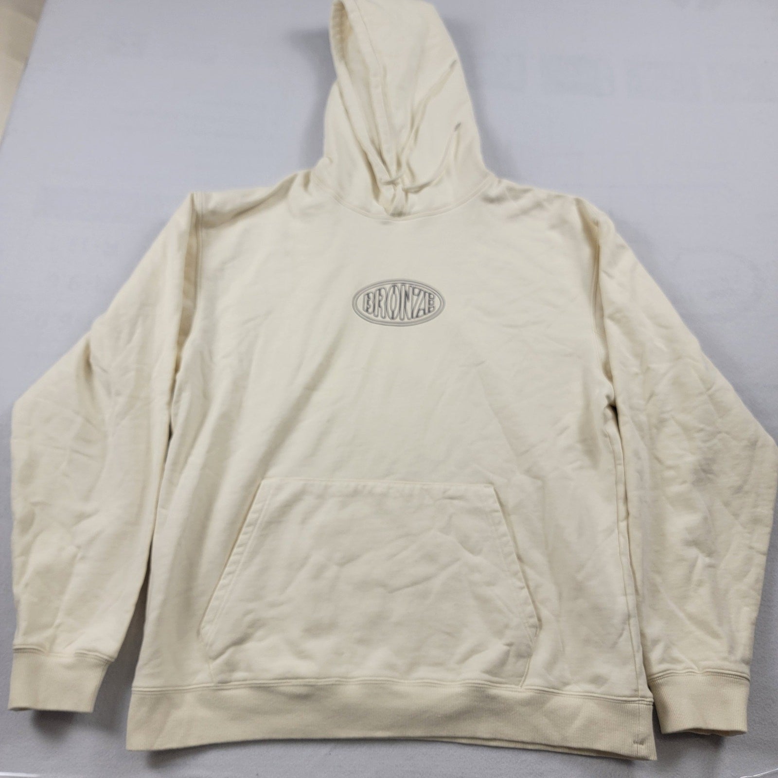 Bronze 56k Oval Hoodie Cream Sz XL